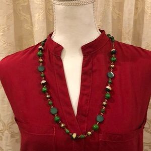 Mix of green,bronze,& cream on 40” beaded necklace